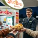 SpudBros jacket potato kiosk at UK petrol forecourt serving customers in 2025