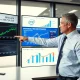 Financial analyst examining Intel stock performance and semiconductor market challenges in 2025
